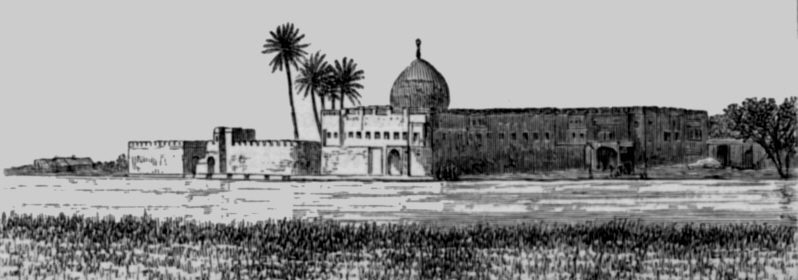 Early twentieth-century black-and-white image of the shrine traditionally identified as Ezra's Tomb in Iraq, seen across trees and water.