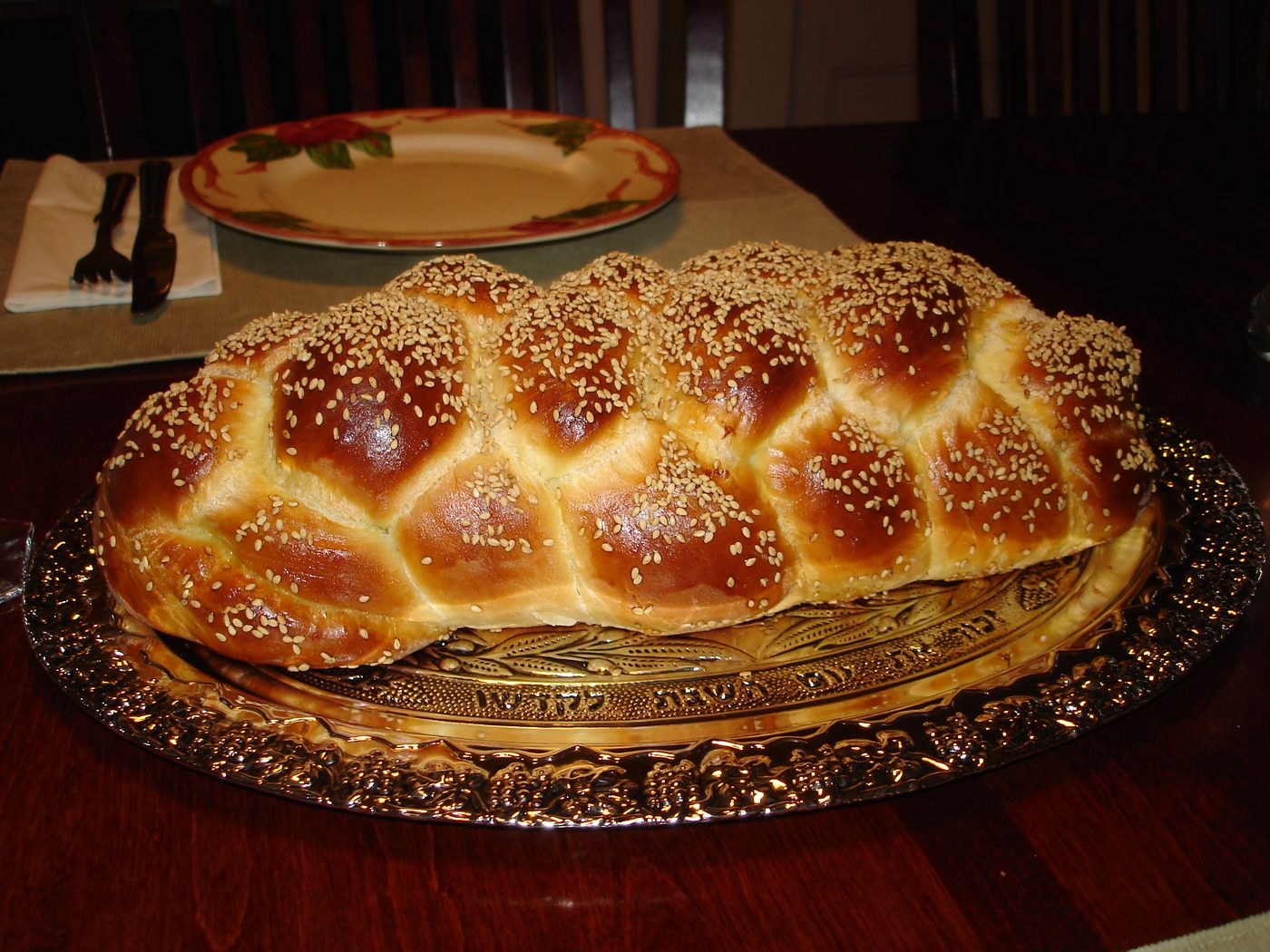 Challah loaves before Shabbat, used here as one face of a wider Jewish bread grammar that also includes Yemenite jachnun and kubaneh.