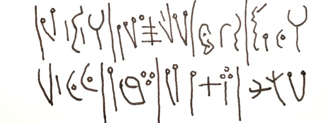 A modern hand-copy of two lines of the Deir Alla inscription, showing its flowing Aramaic-style alphabetic letters written in ink