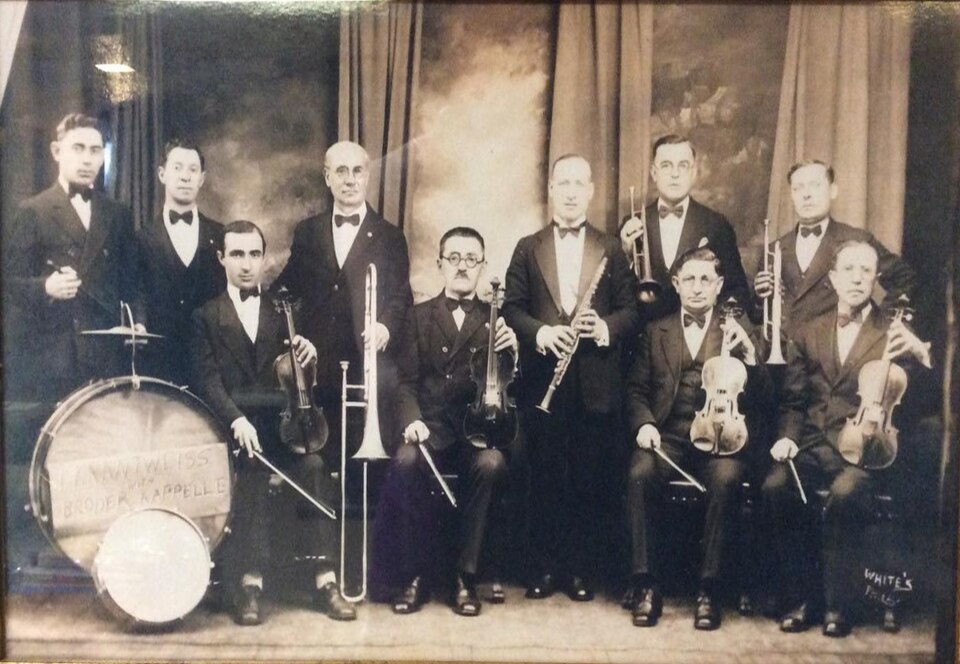 The Broder Kapelle, a 1920s Philadelphia klezmer ensemble, posed with violins, clarinet, trombone, trumpets and a bass drum.