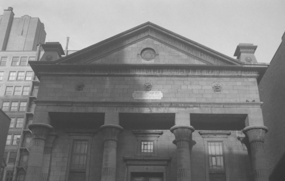 A 1939 Montreal facade on Stanley Street with a Star of David and Hebrew plaque.