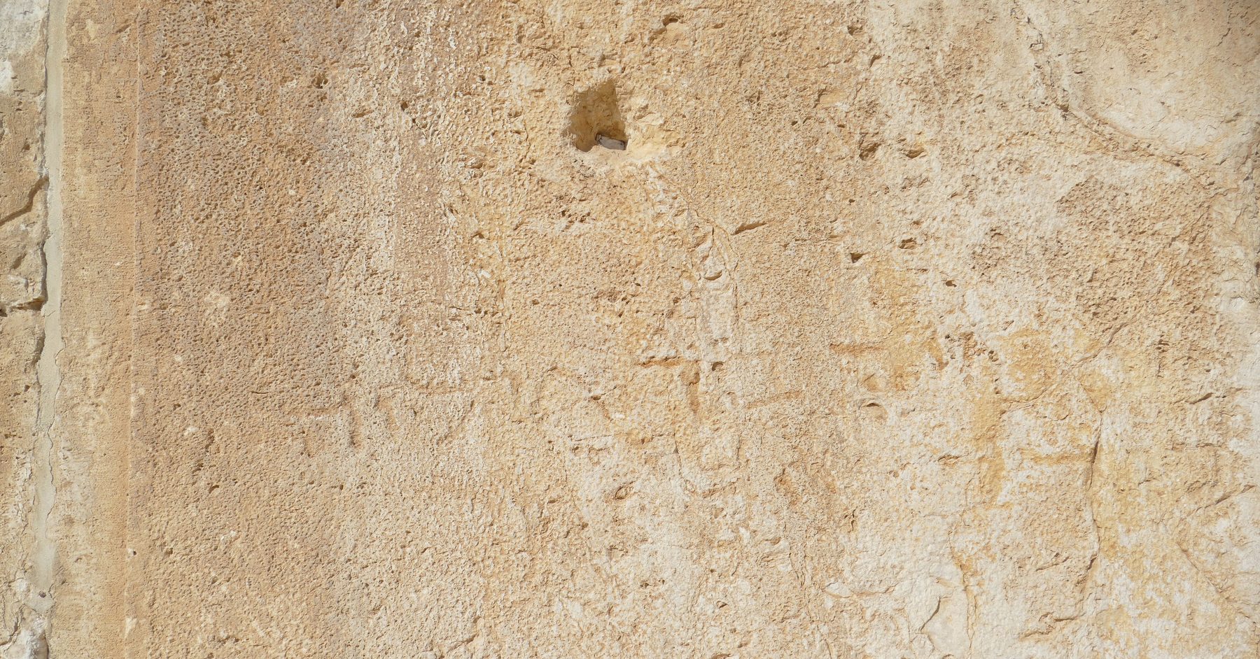 Inscribed fragment of a large pottery storage jar (pithos) with early alphabetic letters incised into the clay before firing