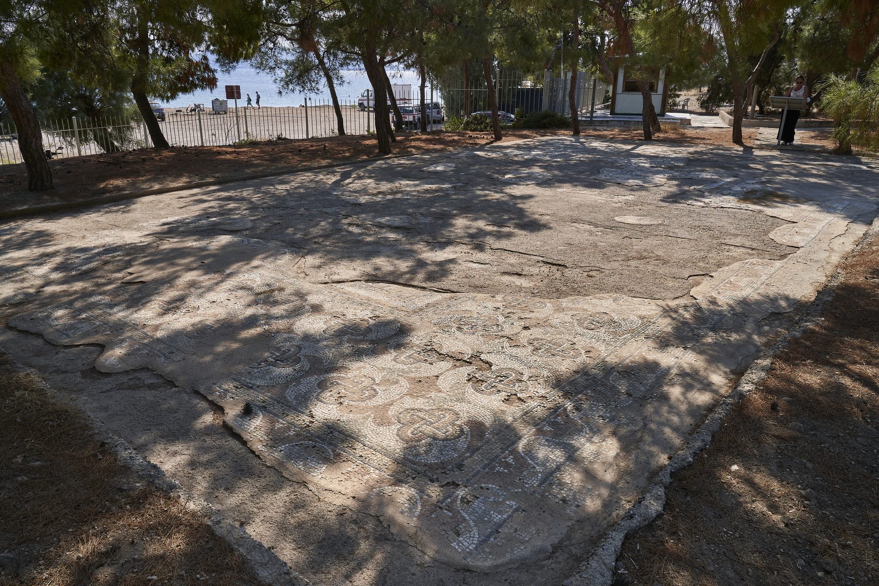 Ancient mosaic floor with geometric patterns preserved in situ at the Aegina synagogue archaeological site