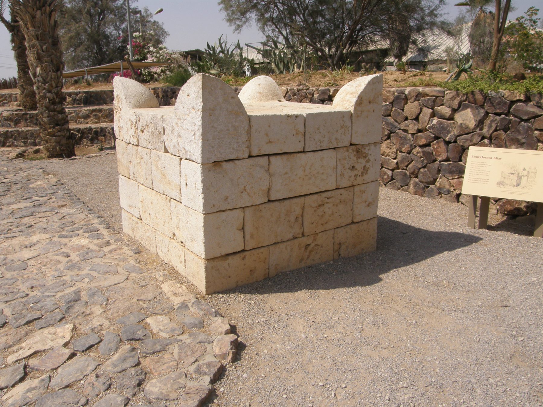 Reassembled horned altar from Tel Beer Sheva showing dressed limestone blocks with four intact corner horns