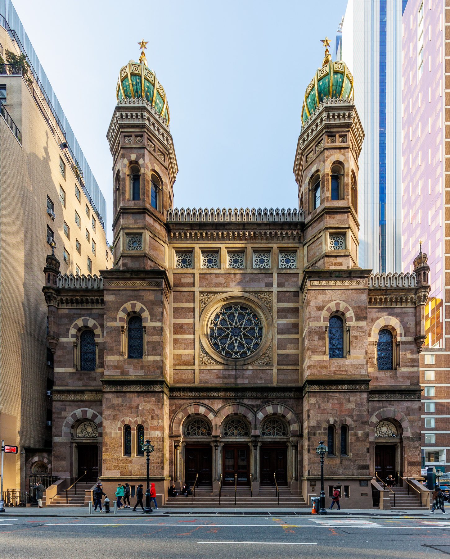 The facade of Central Synagogue with twin Moorish Revival towers topped in green and gold, Lexington Avenue at 55th Street, Manhattan.
