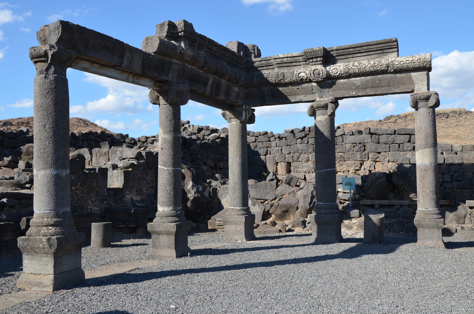 Black basalt columns and decorated lintel of the Chorazin synagogue ruins, Korazim