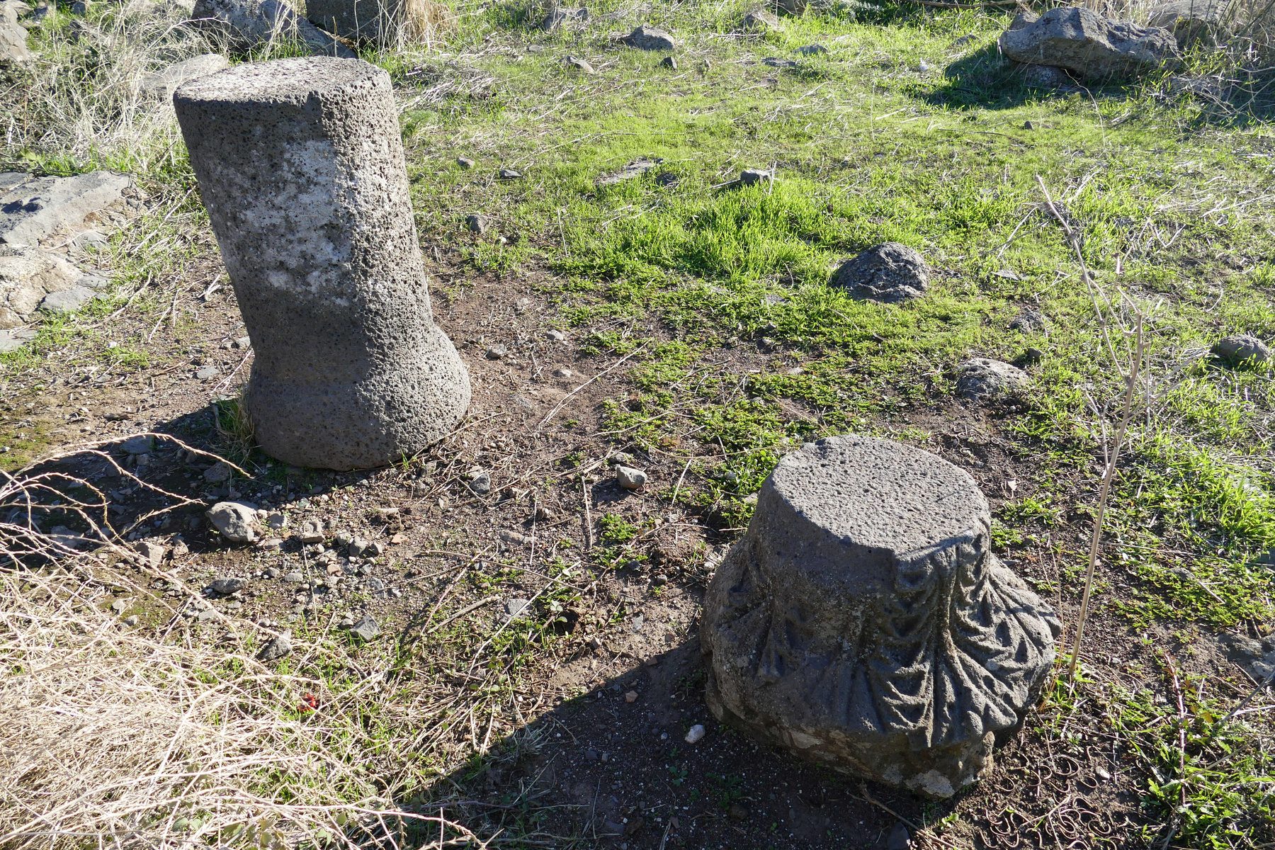 Basalt stone fragments with relief-carved decoration from the Ein Nashut Synagogue, Golan Heights.