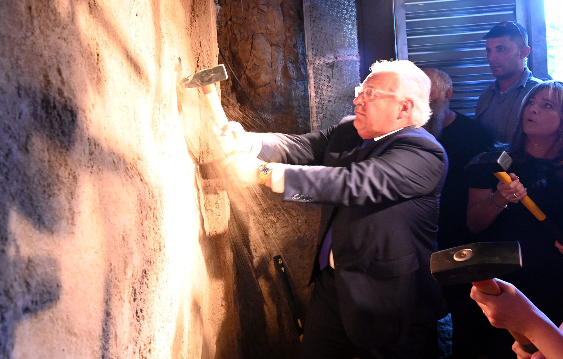 Excavated stepped Herodian pilgrim road with drainage channels during official inauguration at City of David.