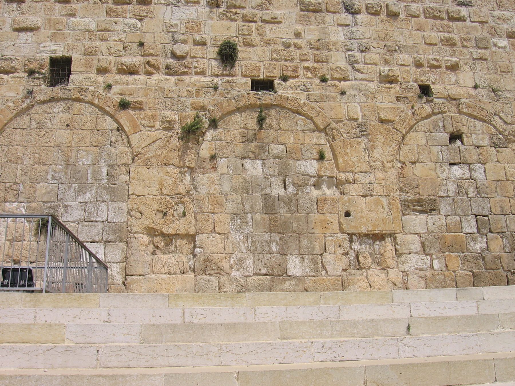 Ancient stone wall showing the blocked double and triple arched gates in the southern wall of the Temple Mount.