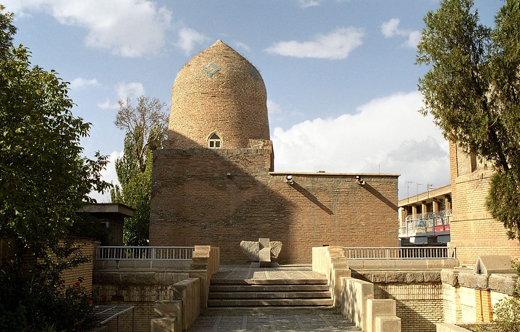 The brick shrine of Esther and Mordechai showing the conical dome and surrounding structures in Hamadan, Iran