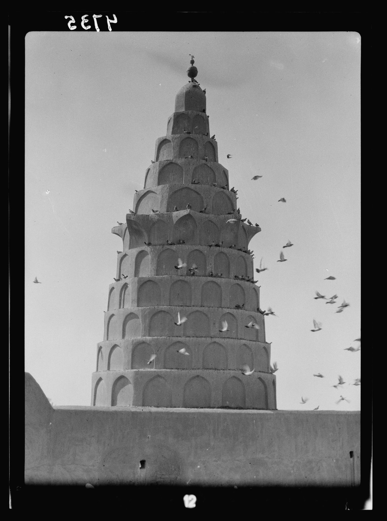 The conical-domed shrine tower of the tomb of Ezekiel at Al-Kifl, Iraq, showing tiered arches and alcoves