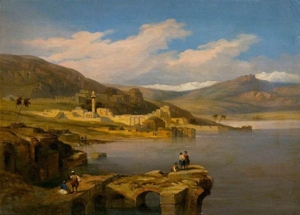 Oil painting showing Tiberias on the western shore of the Sea of Galilee, with robed figures resting on ancient stone ruins in the foreground and the Galilean hills rising behind the town