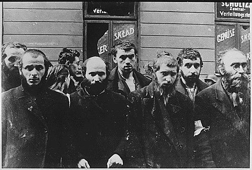 Rabbis standing together during the destruction of the Warsaw Ghetto.